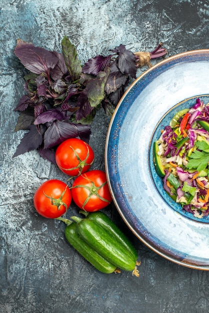 Top view delicious cabbage salad with vegetables on a light-dark background