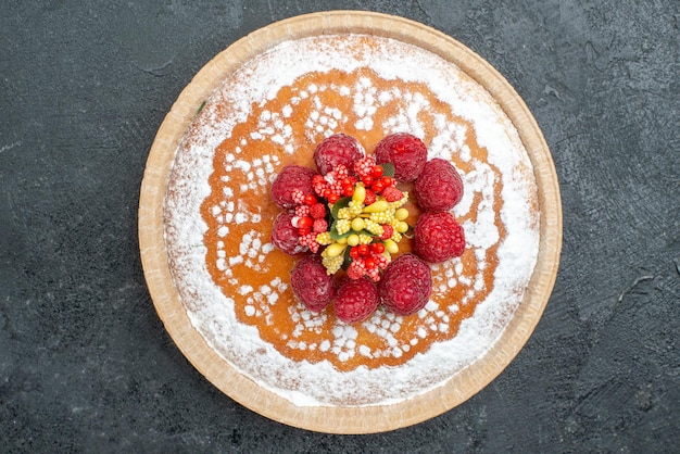 Top view delicious cake with sugar powder and raspberries on grey background pie cake fruit berry sweet cookie