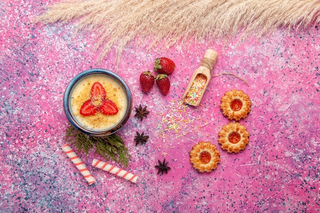 Free Photo top view delicious creamy dessert with red sliced strawberries and cookies on light-pink background dessert ice-cream cream sweet berries fruit