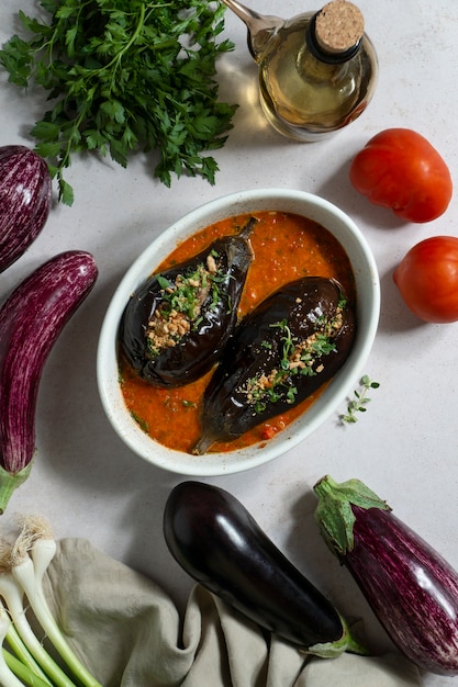 Top view delicious eggplants dish still life