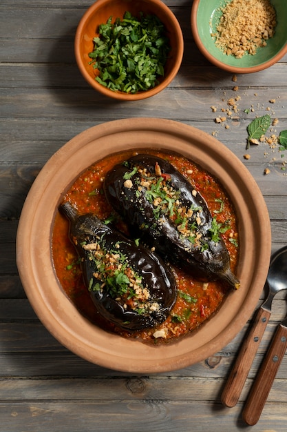 Free Photo top view delicious eggplants dish still life