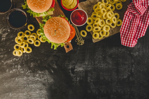 Free Photo top view of delicious fast food menu with onion rings