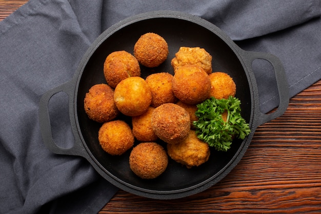 Free Photo top view delicious food croquettes