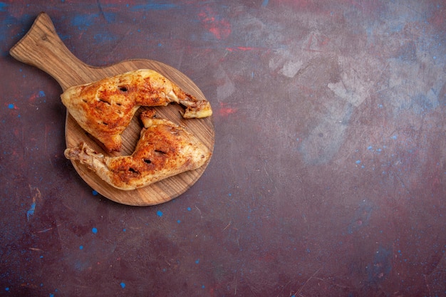 Top view delicious fried chicken cooked meat slices on dark space