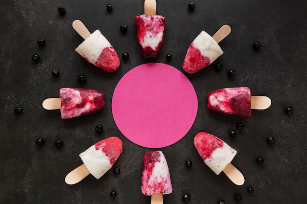 Free Photo top view of delicious fruity popsicles