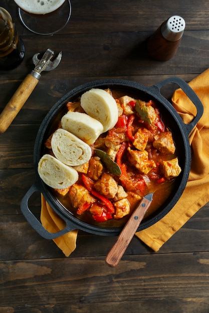 Free photo top view delicious goulash and bread still life