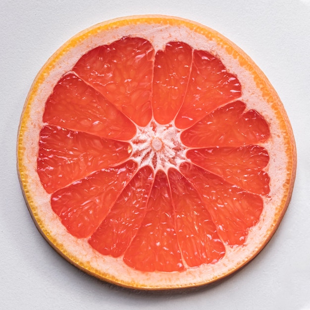 Free photo top view delicious grapefruit slice