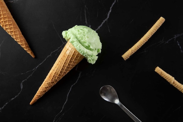 Free photo top view delicious green ice cream still life