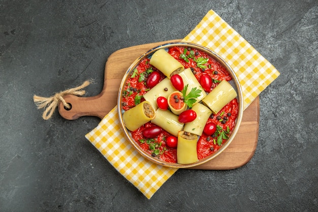 Top view delicious italian pasta with meat and tomato sauce on grey surface meal pasta dough food dinner