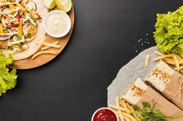 Top view of delicious kebab with salad and french fries