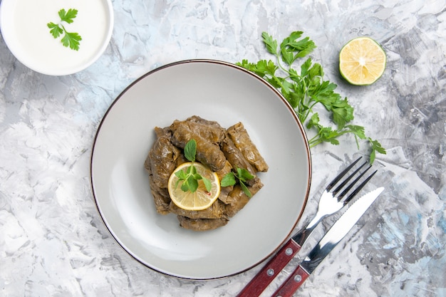 Free Photo top view of delicious leaf dolma with greens on white surface