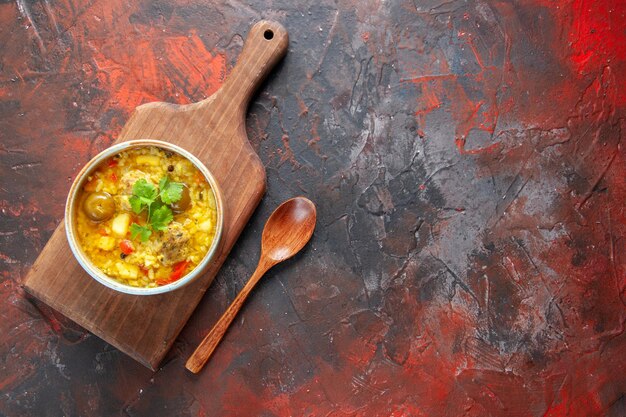 Top view delicious meat soup inside little plate on cutting board dark red background vegetable dish cooking meal cuisine food meat cook free place