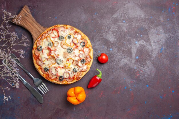 Top view delicious mushroom pizza with cheese olives and tomatoes on dark floor pizza meal dough food italian