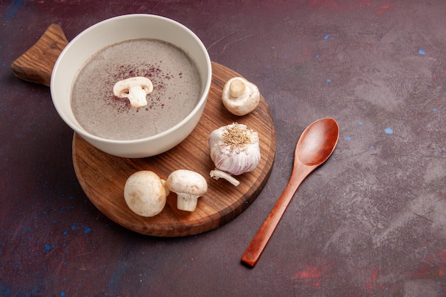 Free Photo top view delicious mushroom soup with fresh mushrooms on dark-purple space