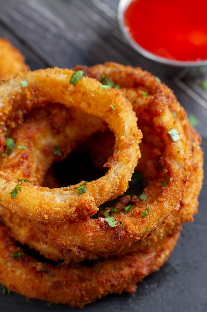 Top view delicious onion rings and sauce