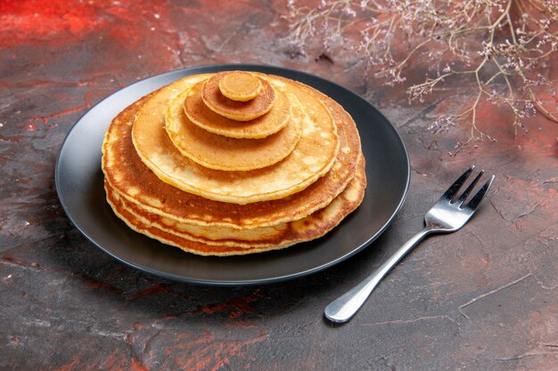 Top view on delicious pancakes pile