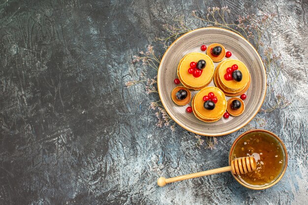 Top view on delicious pancakes with various ingredients