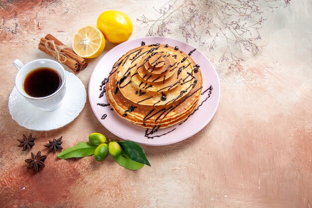 Top view on delicious pancakes with various ingredients