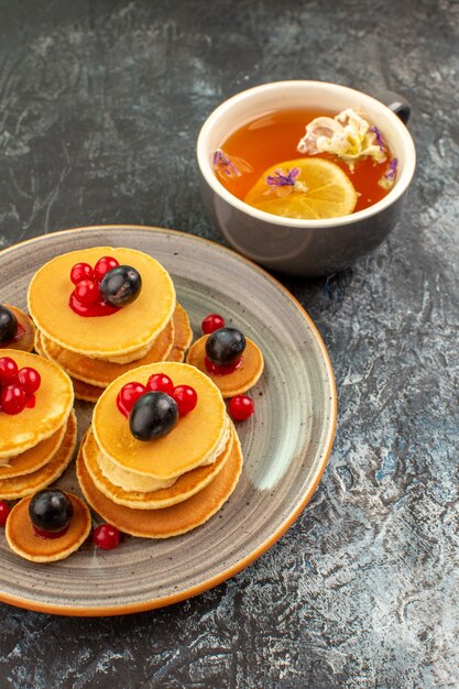 Top view on delicious pancakes with various ingredients