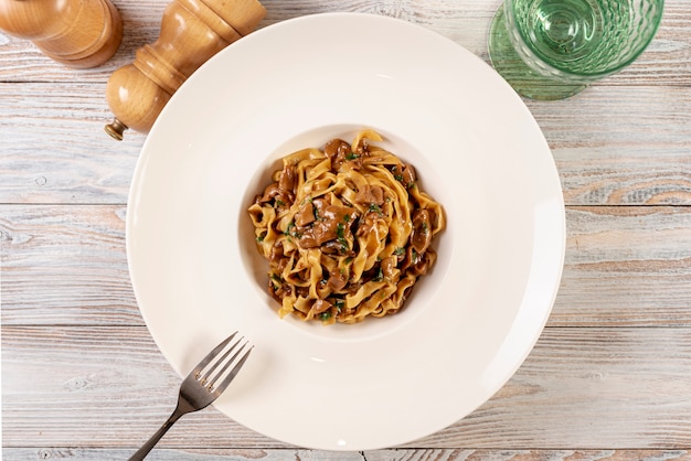 Top view of delicious pasta on wooden table