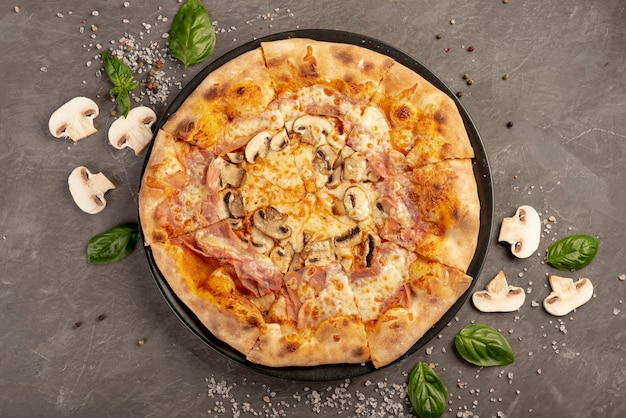 Top view of delicious pizza with mushrooms