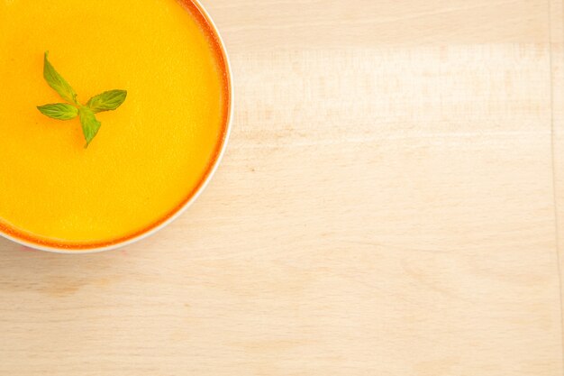 Top view of delicious pumpkin soup in a bowl