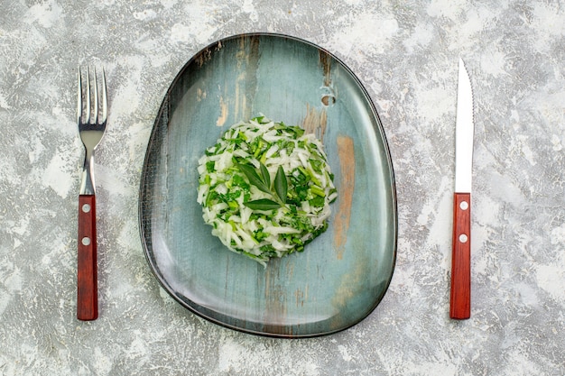 Free Photo top view delicious salad consists of greens and cabbage inside plate