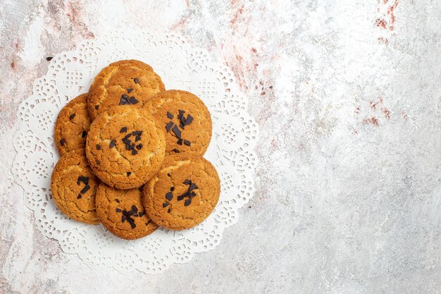 Free photo top view of delicious sand cookies perfect sweets for cup of tea on the white surface