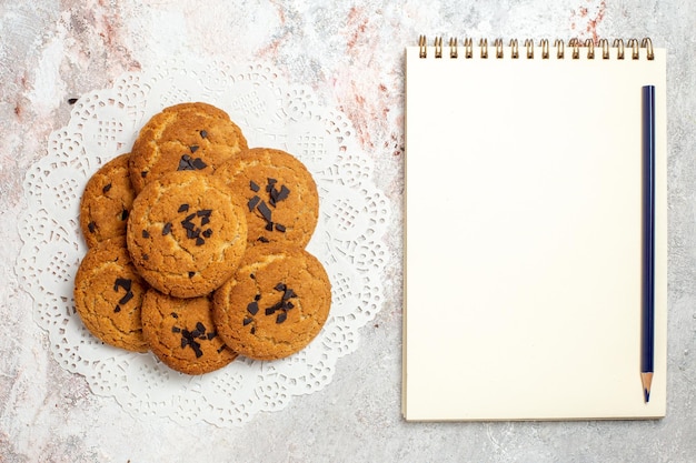 Top view of delicious sand cookies perfect sweets for cup of tea on white surface