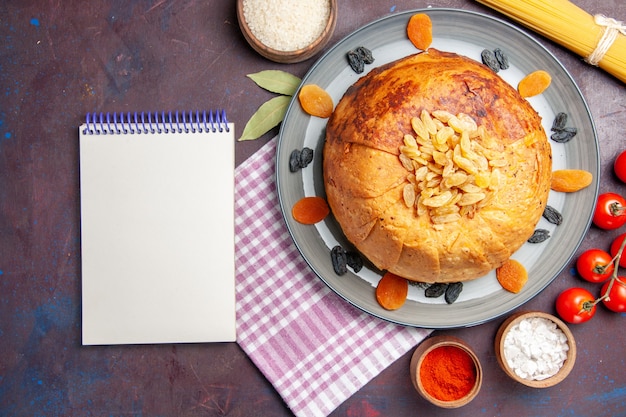 Top view delicious shakh plov eastern meal consists of cooked rice inside round dough on the dark background dough meal food rice