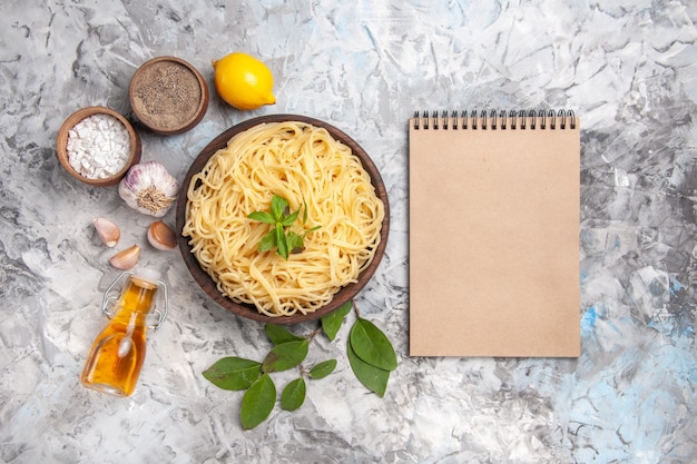 Free photo top view delicious spaghetti inside plate on white table meal dish pasta