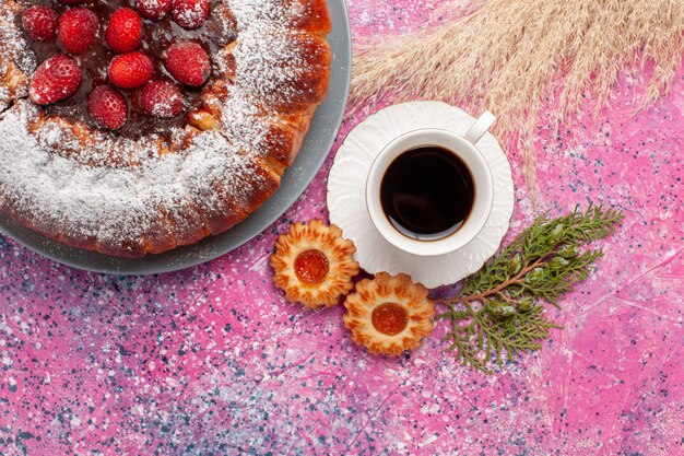 Top view delicious strawberry cake with cookies and cup of tea on pink background cake sweet sugar cookies pie bake