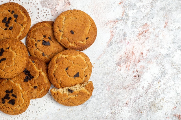 Top view of delicious sugar cookies on white surface