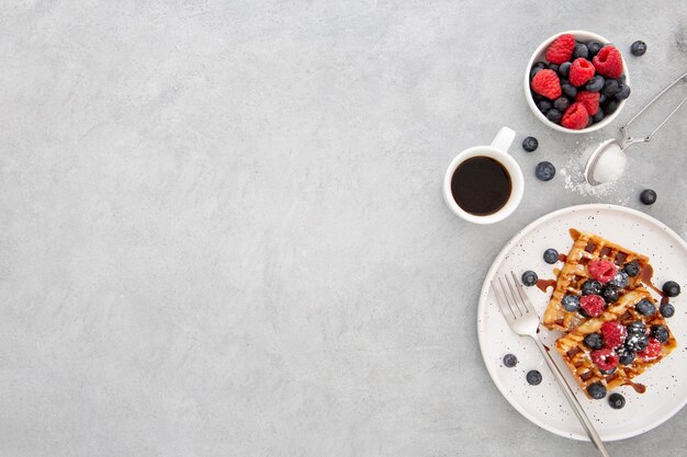 Top view delicious sweet waffles in plate