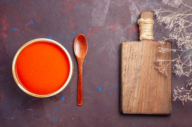 Top view delicious tomato soup cooked from fresh tomatoes on dark desk dish sauce meal tomato soup