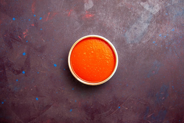 Top view delicious tomato soup cream textured made from fresh tomatoes on dark background sauce soup dish meal tomato