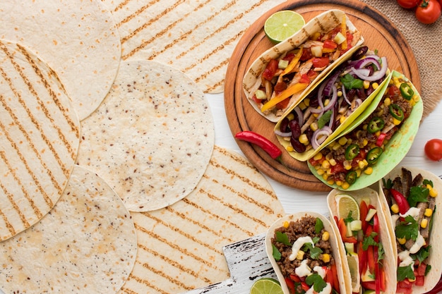 Top view delicious tortillas with meat and vegetables