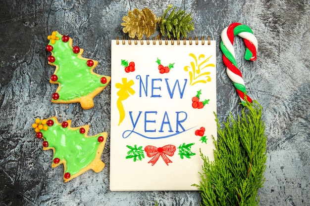 Top view delicious tree biscuits with new year note