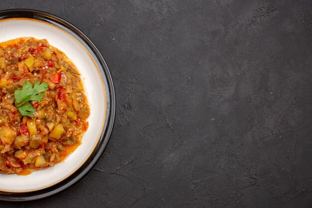 Top view delicious vegetable meal sliced cooked dish inside plate on grey background meal food sauce soup dinner vegetable