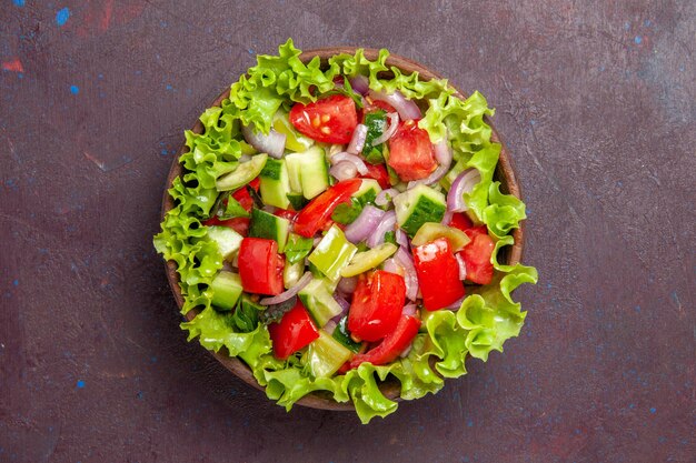 Top view delicious vegetable salad sliced food with fresh ingredients on dark background salad meal snack lunch food color