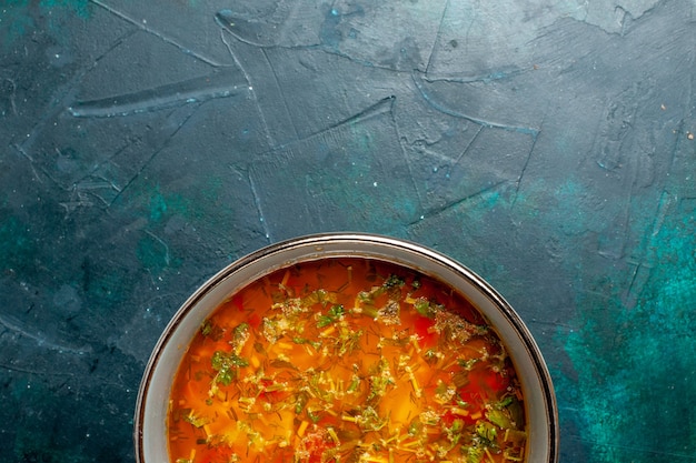 Free photo top view delicious vegetable soup inside plate on a dark green background food vegetables ingredients soup product meal