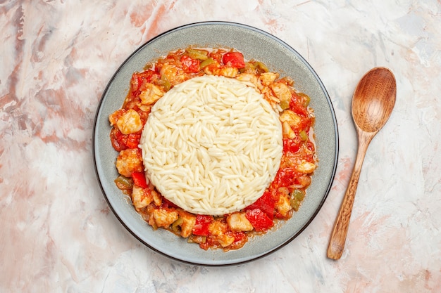 Top view of delicious white rice meal with chicken and vegetables