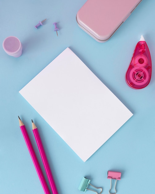 Top view desk arrangement with paper sheet