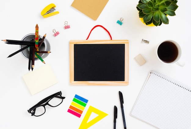 Top view desk concept with chalkboard