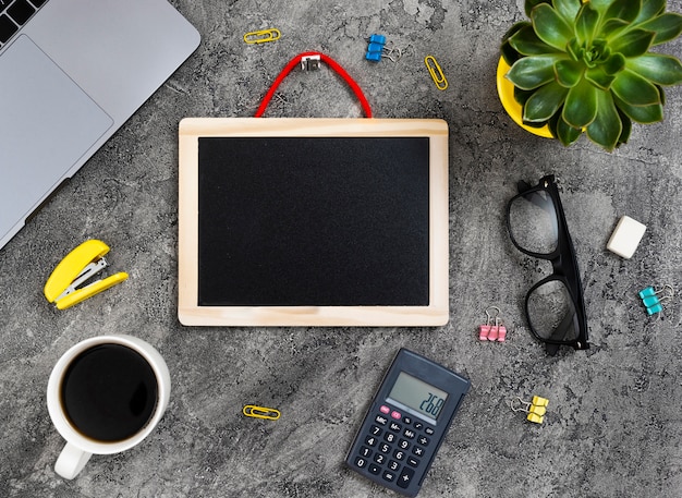 Free photo top view desk concept with chalkboard