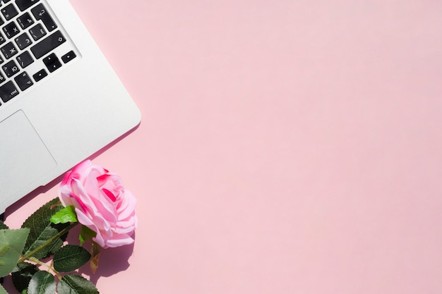 Top view desk concept with pink background