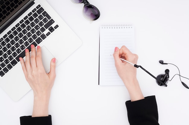 Top view desk concept with woman hands