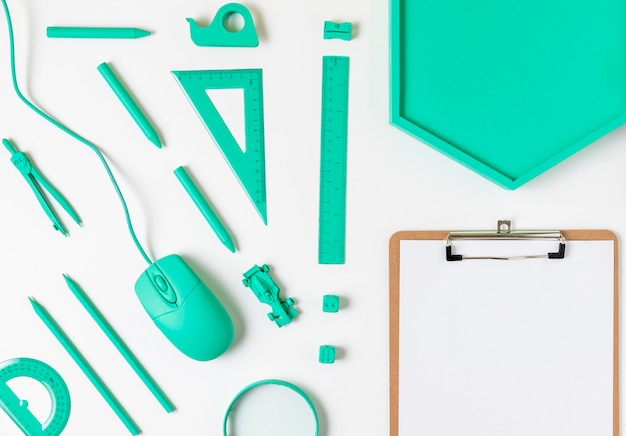 Free photo top view desk minimal blue accessories and clipboard