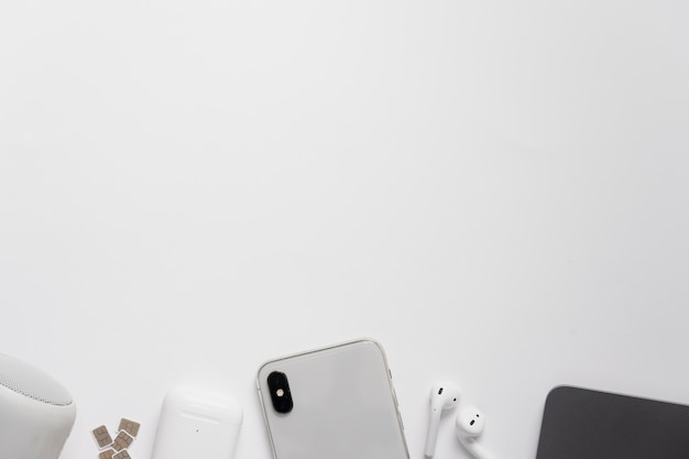 Top view desk with phone and headphones