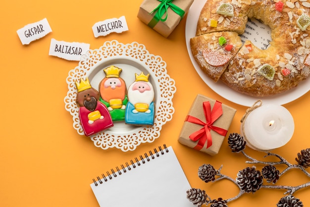 Free Photo top view of dessert with presents and three kings for epiphany day